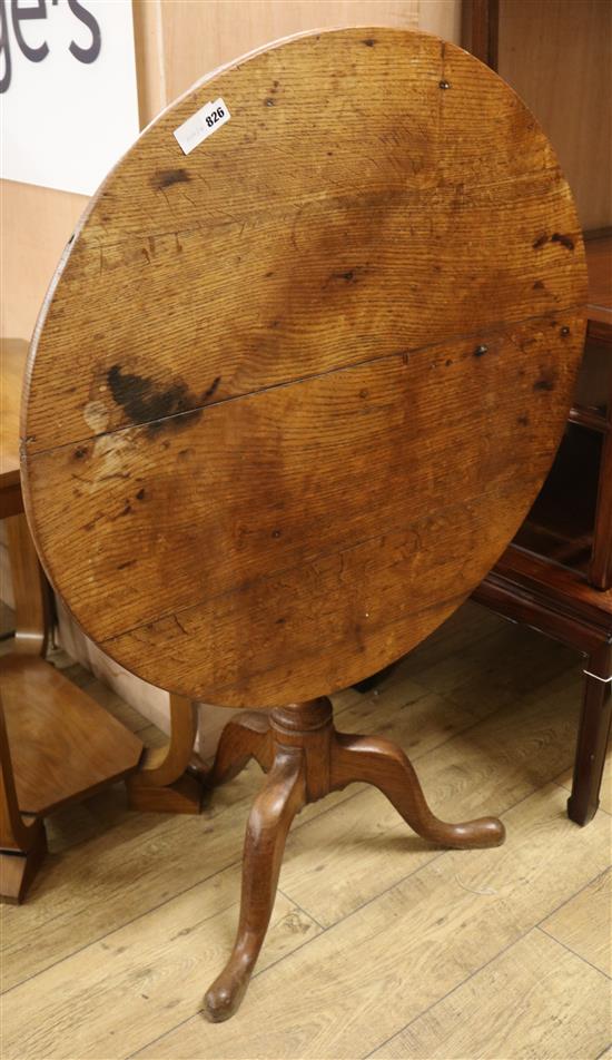 An oak tilt top tripod table W.84cm